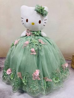 Expertly crafted with 3D lace flowers, the custom Hello Kitty QUINCEAÑERA dress combines fun and elegance for any special occasion. Make a statement and showcase your love for Hello Kitty with this one-of-a-kind dress. Perfect for quinceañeras or any event that calls for a touch of cuteness and sophistication. Green Wedding Gown With Floral Applique, Green Floral Applique Wedding Gown, Green Floral Party Gown, Green Lace Gown For Quinceanera, Green Floral Embellished Party Gown, Princess Style Green Dress For Quinceanera, Green Lace Ball Gown For Prom, Spring Green Ball Gown, Cute Lace Princess Dress For Party