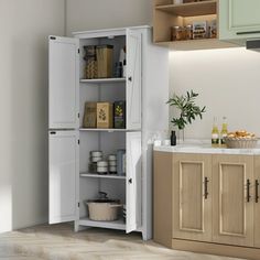 an open cabinet in the corner of a kitchen