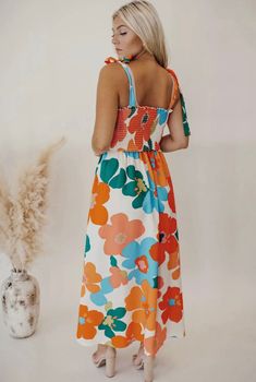 The vibrant print and flowy design will make you stand out in any crowd! With a flattering fit and comfortable material, you’ll feel beautiful all day long! 100% Polyester Model is 5’7 and wears a small Floral Print Design, Floral Dresses Long, Square Neck Dress, Floral Print Maxi Dress, Floral Print Maxi, Basic Style, Wide Leg Jumpsuit, Floral Maxi, Fitted Bodice