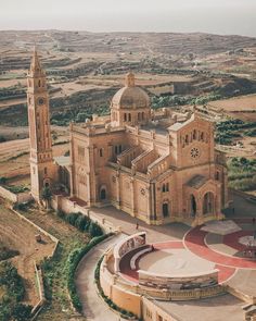 an aerial view of a church in the middle of nowhere