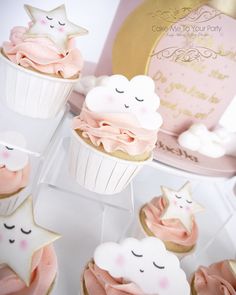 cupcakes with pink frosting and stars on them