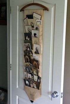 a tie hanging on a door with pictures and photos attached to the back of it