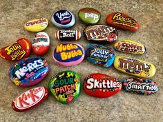 many different types of candies are on the counter top, including one for skittles