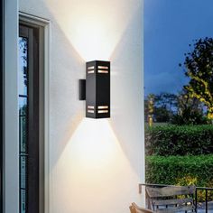 an outdoor wall light on the side of a house