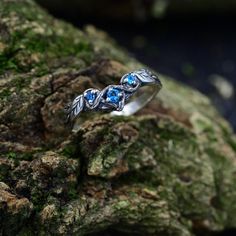 Handmade from sterling silver, our Medieval Aquamarine Nature Inspired Ring exudes vintage charm and ethereal beauty. Adorned with a Celtic branch and knot pattern, this unique piece features a fantasy braided branch with a leaf wedding band. Perfect for Valentine's Day or as a unique fantasy ring, this silver jewelry captures the essence of the Nenya ring forest with its rustic tree ring aesthetic, making it a distinctive and timeless accessory.  Characteristics: Metal - Recycled solid sterling Silver Ethereal Jewelry With Birthstone, Ethereal Silver Jewelry For Anniversary, Ethereal Silver Jewelry For Wedding, Ethereal Silver Wedding Jewelry, Nature-inspired Blue Jewelry For Wedding, Blue Nature-inspired Jewelry For Wedding, Nature-inspired Blue Jewelry For Weddings, Silver Nature-inspired Crystal Wedding Ring, Ethereal Silver Crystal Ring For Anniversary