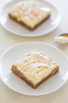 two white plates topped with slices of cake