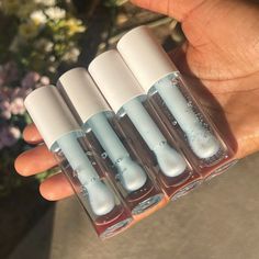 CLOUD 9 ☁️✨ is a perfect combination of sweet and refreshing. The mint flavor adds a cool touch to your lips, and the strawberry scent is just delightful. One of my favoriate things about Cloud 9 is that this gloss is packed with Vitamin E. Not only does Vitamin E help protect your lips from damage, but it also has other benefits that can make your lips look and feel healthier. For example, it contains fatty acids that can help moisturize and nourish your lips, leaving them soft and supple. Ingr Gloss Diy, Lips Gloss, Strawberry Scent, Revlon Makeup, Lip Gloss Cosmetics, Diy Lip Gloss, Lip Gloss Collection