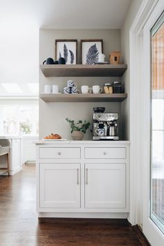 the kitchen is clean and ready for us to use it's coffee maker on the counter