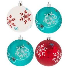 four glass ornaments with snowflakes on them are shown in different colors and sizes