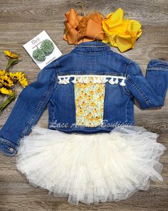 Elevate your little one's style with our custom-made denim jacket! Handcrafted with a vibrant floral sunflower pattern and beige tassels, this jacket is an eye-catching addition to any wardrobe. Available in size XS or 5Y, it's perfect for making a statement at any event. Shop now for fast shipping at our children's clothing boutique! custom-made denim jacket, floral sunflower pattern, beige tassels, children's boutique, fast shipping, unique party ready outfits