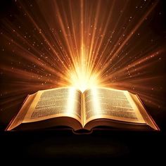 an open book with bright light coming from it