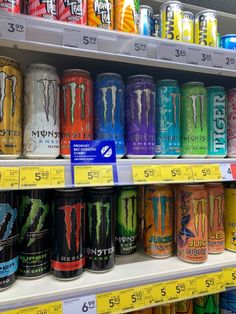 cans of monster energy drink on display in a store