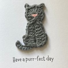 a cat made out of yarn with the words have a purr - fect day