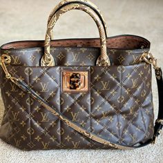 This Bag Is In Pristine Condition As It Was Never Worn. Limited Edition, Purchased In Chicago At The Lv Boutique. Soft Quilted Monogram Canvas With Python Handles And Shoulder Strap, Ostrich Leather Lining. The Hardware Is A Tiger Eye Turn Lock On Polished Brass. Inside Zipper Pockets. Dust Bag And Cites Certificate Also Included. Luxury Bag With Monogram Print And Double Handle, Elegant Gold Bag With Monogram Print, Luxury Bags With Monogram Print, Luxury Gold Bag In Coated Canvas, Luxury Gold Signature Coated Canvas Bags, Ostrich Leather, A Tiger, Polished Brass, Monogram Canvas