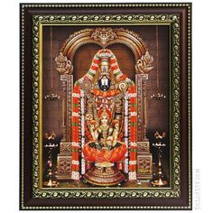 an image of lord ganesha on display in a wooden frame