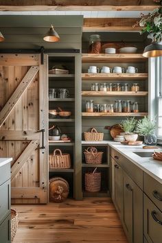 a kitchen with open shelving and wooden floors