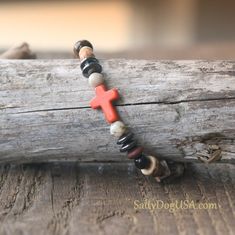 Handmade Unisex Beaded Cross Bracelet Spiritual Gift Idea for everyday wear or any religious event! Catholic Bracelet. Spiritual Bracelet.  I made this Rustic Cross Bracelet with 6mm Gemstones, Coconut Wood, Gunmetal Spacers, Orange Howlite  Sideways Cross. On Jewelers Stretch Cord.  Includes a Complimentary Gift Box with Silver Stretch Bow.    ✨These gemstones have a calming and soothing energy to encourage mindfulness, restore balance and therefore bring stress relief.  *Gift Giving Ideas: BFF Catholic Bracelet, Spiritual Bracelets, Coconut Wood, Rustic Cross, Beaded Cross, Silver Bow, Pretty Box, Cross Bracelet, Spiritual Gifts