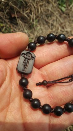 +. This is a Wooden Rosary Bracelet. +.It is knotted bracelet and it is adjustable . +.The crufix is carved in elevorate and three dementional shape. +.+.+.+.+. Materials +.+.+.+.+.+. Cross: Mpingo(Africa black wood) Beads : ebony 8mm +.+.+.+.+. Size +.+.+.+.+. Cross : 13.3mm(Width) *20mm(Height) Beads: 8mm +. Engraved characters(e.g. baptismal name, name,etc) on back side. please send characters that you want. Please let me know by message. It's Free engraving +.Wood is a natural Product. Pleas Jujube Tree, Mens Rosary, Wooden Rosary, Engraving Wood, Personalized Rosary, Knotted Bracelet, Catholic Cross, First Communion Gifts, Bracelet Knots