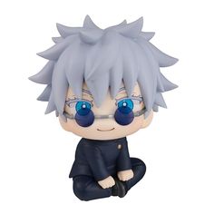 an anime figurine with blue eyes sitting on the ground next to a white background