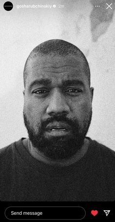 a black and white photo of a man with a beard