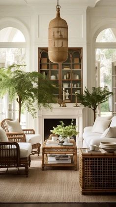 a living room filled with furniture and a fire place in front of a fireplace surrounded by potted plants