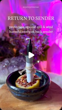 a bowl with some food in it on top of a wooden table next to purple flowers