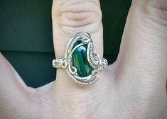 - handmade ring - malachite centerpiece - sterling silver wire - original finish - US size 6.5 Silver Malachite Rings As Gift, Handmade Silver Malachite Rings, Handmade Malachite Ring Jewelry, Handmade Malachite Ring, Unique Green Wire Wrapped Rings, Hand Wrapped Green Sterling Silver Jewelry, Malachite Ring, Pride Bracelet, Ring Wire