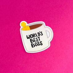 a sticker that says world's best boss in a cup on a pink background