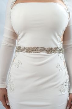 "this wavy crystal belt or sash is hand beaded with rhinestone and white clear glass beads. the beading goes all around your waist and the bridal belt close in the back with hook and eyes. perfect fitted sash for and after the wedding party. please select your waist size (which will be the length of the belt) in the drop menu. if you are in between sizes, please chose the closest and put a note at checkout with the exact measurement. you can also order this belt in standard size (which is 18\" o Elegant Beaded Bridal Belt, Elegant Beaded Fitted Bridal Belt, Bridal Belt With Rhinestones And Crystal, Fitted Silver Crystal Bridal Belt, Fitted Bridal Belt With Rhinestones And Crystal, Fitted Crystal Bridal Belt For Party, Embellished Crystal Bridal Belt, Fitted Crystal Embellished Bridal Belt, Fitted Crystal Bridal Belt Embellished