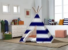 a teepee is sitting in the middle of a room