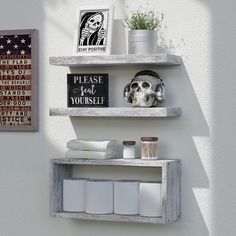 two wooden shelves with various items on them and one has a skull in the middle