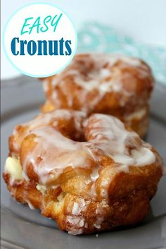 two glazed donuts on a plate with the words easy cronuts above them