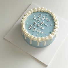 a frosted birthday cake with white icing on top