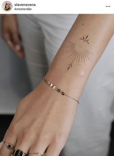 a woman's arm with a tattoo on it and the word love written in cursive letters