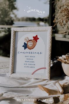 a baseball themed photo frame sitting on top of a table