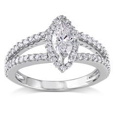 a white gold engagement ring set with an oval cut diamond surrounded by small round diamonds