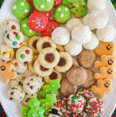 a white plate topped with lots of different types of cookies