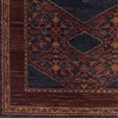 an old rug with many different colors and patterns