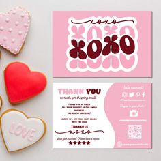 some cookies and candy on a table with thank you cards in the shape of hearts