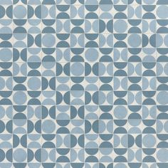 a blue and white tiled wall with circles