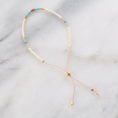 These fun delicate beaded bracelets are fully adjustable making them the perfect gift. (And yes, self-gifting is highly recommended!) style name: PHOENIX colors: ivory, turquoise, red and gold glass and gold-plated seed beads on durable blush silk cord sliding bead makes it fully adjustable from 5" - 9" finished with gold-filled crimps that won't tarnish to keep your jewelry looking new, avoid water, lotions and perfumes all Libby & Smee beaded bracelets come packaged on a logo card in a clear r Adjustable Gold Friendship Bracelets With Colorful Beads, White Beaded Bracelets With Adjustable Chain, Adjustable White Beaded Bracelet, Minimalist Adjustable Jewelry With Colorful Beads, White Bohemian Bracelet With Adjustable Chain, Dainty White Jewelry With Sliding Knot, Adjustable Everyday Dangle Bracelets, Dainty White Beaded Bracelets With Adjustable Chain, Adjustable Red Beaded Dangle Bracelets