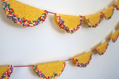 a cake bunting with sprinkles on it