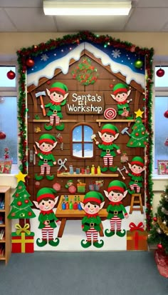 an office decorated for christmas with elfs and elves on the front wall, surrounded by holiday decorations