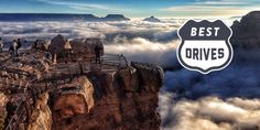 people standing on the edge of a cliff above clouds