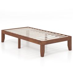 a wooden bed frame with slats on the bottom and foot board, in front of a white background