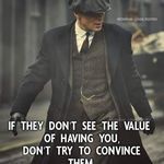 a man in a suit and hat walking down the street with a quote on it