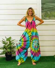 "Step into the world of boho chic with our stunning handmade jumpsuit. Crafted from soft and breathable 100% rayon fabric, this jumpsuit is designed for comfort and style. The adjustable tie shoulders allow for a customizable fit, while the wide legs create a flowy and relaxed silhouette. Measuring 45 inches when tied at the shortest and 50 inches at longest length, this jumpsuit is perfect for any occasion. Whether you're heading to a summer festival or simply lounging around, this jumpsuit is Bohemian Overall Jumpsuits And Rompers For Vacation, Bohemian Jumpsuits And Rompers For Vacation, Bohemian Overall Jumpsuits And Rompers For Festival, Bohemian Overalls Jumpsuits For Festival, Multicolor Summer Jumpsuits And Rompers For Loungewear, Summer Multicolor Jumpsuits And Rompers For Loungewear, Bohemian Summer Overalls Jumpsuits And Rompers, Bohemian Beach Overalls And Rompers, Bohemian Cotton Jumpsuits And Rompers For Spring