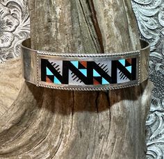 Beautiful Geometric Zuni Inlay Design Cuff Bracelet Hand Signed by Zuni Artisans Leander and Lisa Othole  Turquoise, Mother of Pearl, Coral 33 grams Measures 5 3/4" inside with 1 1/2" opening  5/8" wide band 2" long design area I came into possession of a collection of vintage Native American new old stock jewelry and will be listing it here on Etsy. I am doing as much research as I can but cannot give definite makers and dates on some items- though the majority is around the 1980s give or take. Inlay Design, Stone Inlay, Wide Bands, Multi Stone, Arm Band, Cuff Bracelet, Mother Of Pearl, Native American, Cuff Bracelets