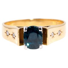 Forged in 18 carat gold, this fabulous vintage ring, circa 1970s, sees a yellow gold band holding a stunning 1.62 carat cushion-shaped deep greenish blue "Teal" Australian-type sapphire at the top and four flanking star-set diamonds in the shoulders. She has been named The Fay Ring. A wonderful choice for any occasion, she is as elegant as the one who wears her and comfortable to wear. The Fay Ring Gem Details The centre cushion-shaped deep greenish blue "Teal" Australian-type sapphire measures Greenish Blue, Blue Teal, Vintage Ring, Gold Band, Vintage Jewellery, Free Jewelry, Gold Bands, Vintage Rings, Gold Ring