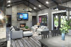 a living room filled with furniture and a flat screen tv mounted to the wall over a fireplace